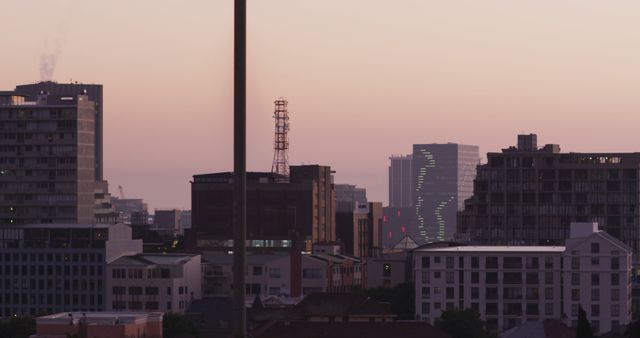 General view of cityscape with multiple tall skyscrapers and buildings at sunset. skyline and modern urban architecture.