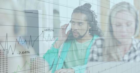 Man Analyzing Financial Data on Computer with Graph Overlay
