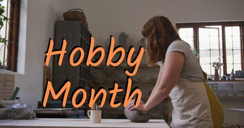 Woman engaged in pottery craft for hobby month celebration