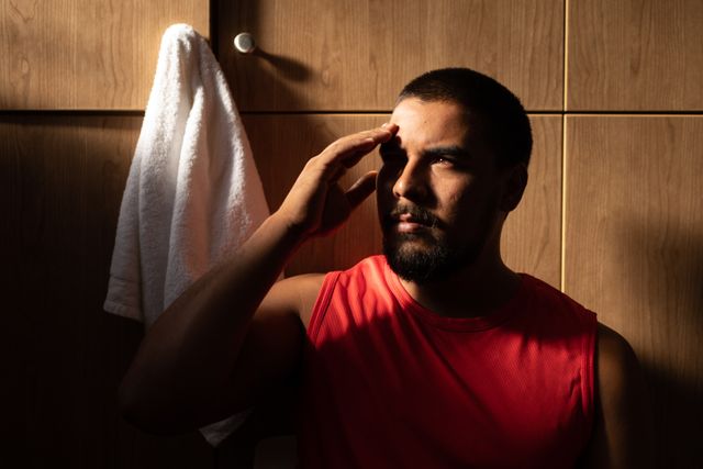 Biracial Male Football Player Resting in Changing Room - Download Free Stock Images Pikwizard.com
