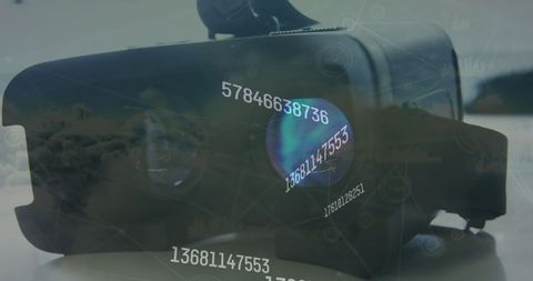 Digital Numbers Projected on VR Headset Against Cloud Background