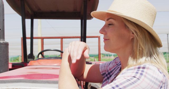 Smiling Farmer Woman Leaning on Tractor Outdoors - Download Free Stock Images Pikwizard.com