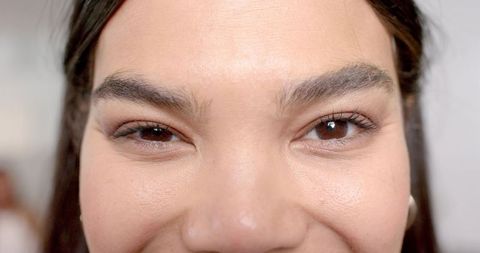 Close-up of Woman Winking, Highlighting Elegance and Sophistication