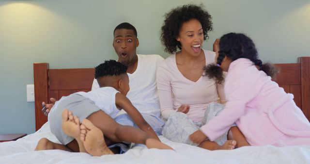 Happy Family Having Fun on Bed with Children Laughing - Download Free Stock Images Pikwizard.com