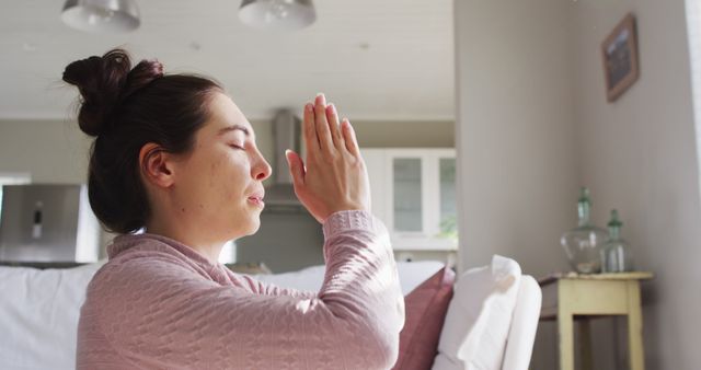 Peaceful Woman Meditating in Cozy Living Room Setting - Download Free Stock Images Pikwizard.com