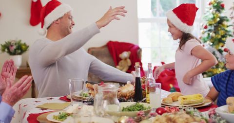 Family Celebrating Christmas Lunch with Joyful Interaction - Download Free Stock Images Pikwizard.com