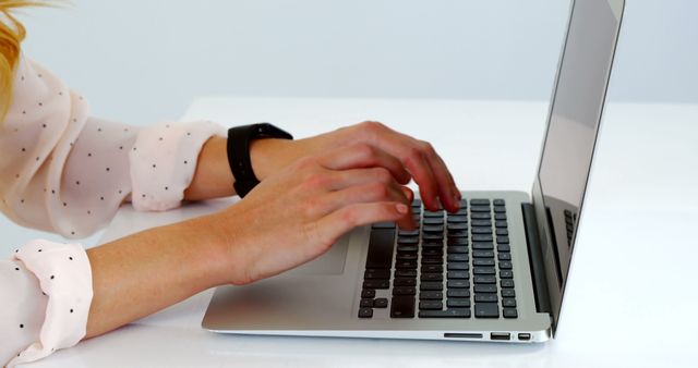 Close-up of woman typing on laptop at work desk - Download Free Stock Images Pikwizard.com