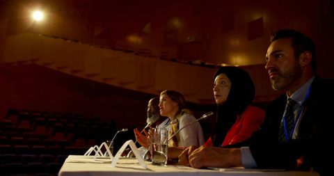 Diverse Panel of Professionals Attending Business Conference