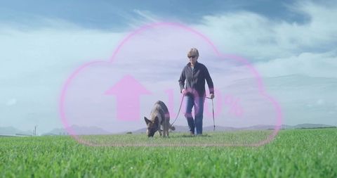 Woman Walking German Shepherd Through Scenic Green Field