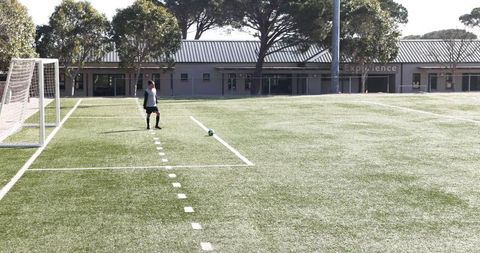 Youth soccer players focused during sunny day match