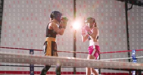 Female Boxers Sparring in Ring Wearing Headgear and Gloves with Binary Data Overlay