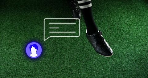 Soccer cleats and chat icons on green field concept