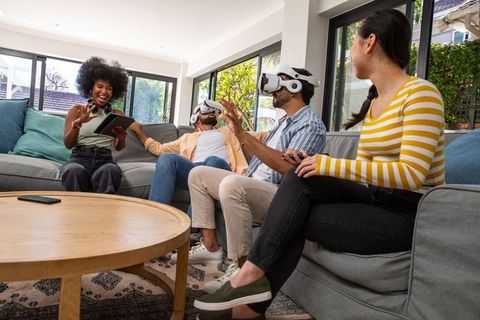 Diverse Group Enjoying Virtual Reality in Modern Living Room