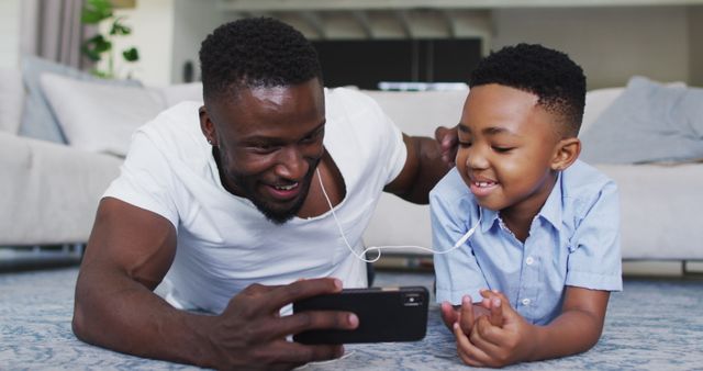 Father and Son Bonding Listening Music Smartphone Living Room - Download Free Stock Images Pikwizard.com