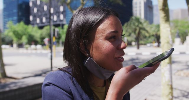 Woman using smartphone voice assistant outdoors in urban area - Download Free Stock Images Pikwizard.com