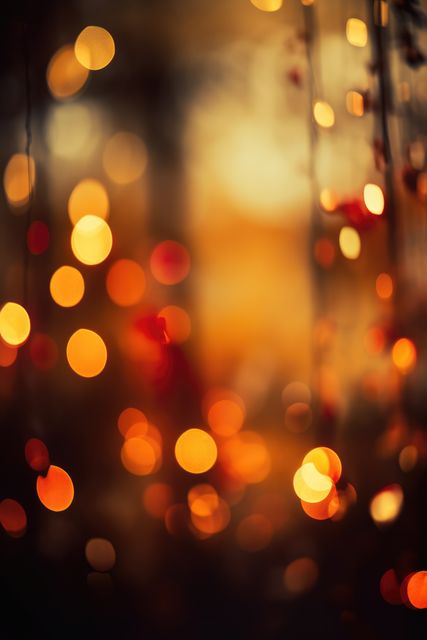 Trees and orange and yellow bokeh sunlight spots, vertical, created using generative ai technology. Atmospheric nature bokeh background, digitally generated image.