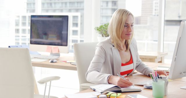 Focused Businesswoman Working on Desktop in Modern Office - Download Free Stock Images Pikwizard.com