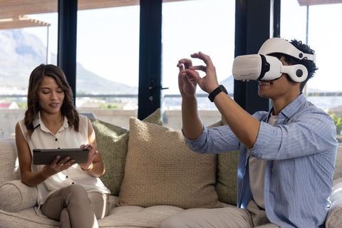 Friends Enjoying VR and Tablets in Bright Modern Living Room
