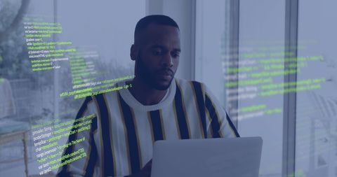 Focused businessman analyzing data with digital overlay in modern office