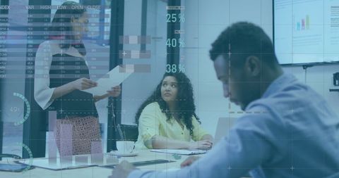 Financial data overlay with diverse team collaborating in modern office