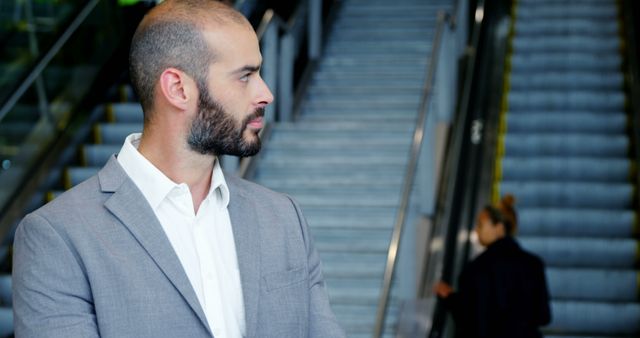 Confident Businessman in Modern Office Building Interior - Download Free Stock Images Pikwizard.com