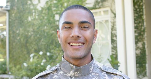 Smiling Biracial Male Soldier in Uniform Outdoors