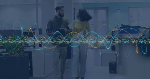 Walking coworkers collaborating with tablet and waveform data overlay in open office
