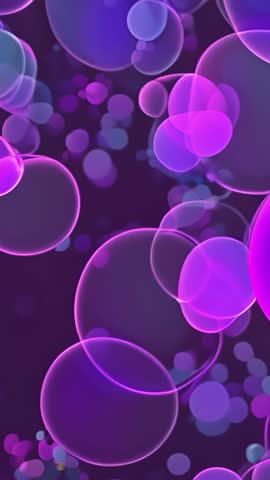Vertical looping video of glowing purple bubbles and drifting luminous dots for backgrounds
