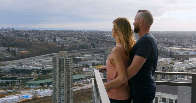 Couple Enjoying Cityscape View from High Balcony - Download Free Stock Images Pikwizard.com