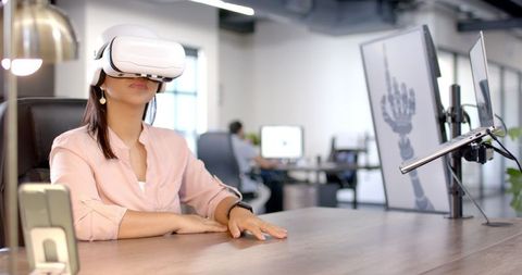 Businesswoman Using VR Headset for Innovative Interface Interaction