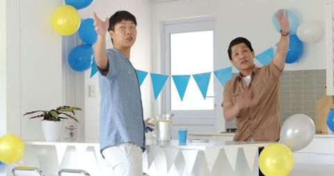 Father and son decorating for festive family celebration