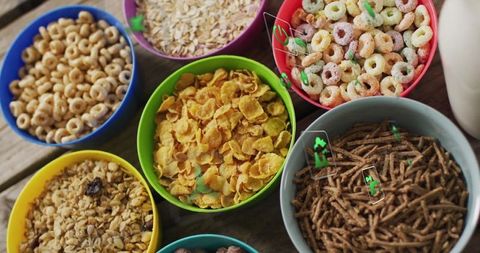 Assorted Colorful Cereal Bowls on Wooden Table from Above