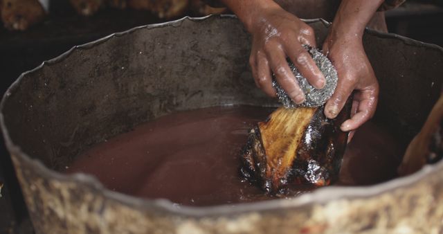 Hand Scrubbing Object in Rusty Container with Liquid - Download Free Stock Images Pikwizard.com