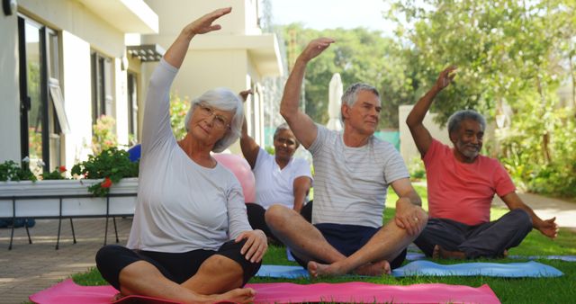 Senior individuals participate in an outdoor yoga session, with copy space. Embracing wellness and community, they engage in exercises promoting flexibility and relaxation.