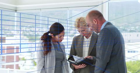 Business Professionals Engaged with Digital Interface in Modern Office