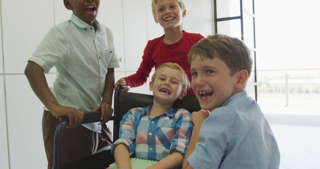 Happy Kids Playing with Friend in Wheelchair in Bright Classroom - Download Free Stock Images Pikwizard.com