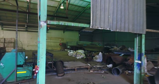 Abandoned Industrial Warehouse with Disorganized Metal Scrap - Download Free Stock Images Pikwizard.com