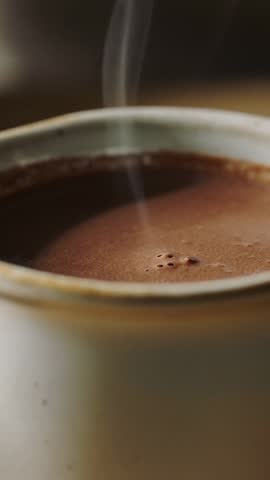 Steaming Ceramic Mug Close-Up Vertical Video Showing Bubbling Hot Coffee on Wooden Table