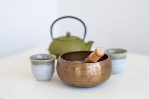 Traditional tea set with rustic wooden mortar and pestle