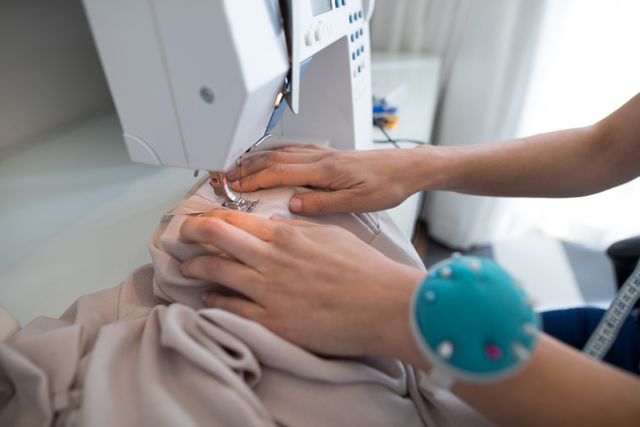 Fashion designer using sewing machine - Download Free Stock Photos Pikwizard.com