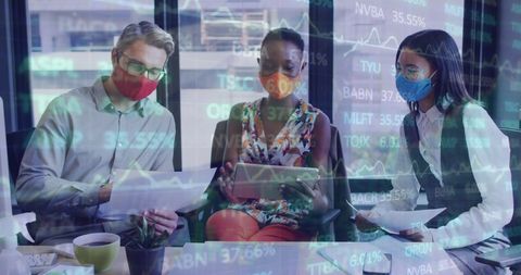 Diverse Team Analyzing Stock Data with Digital Interface