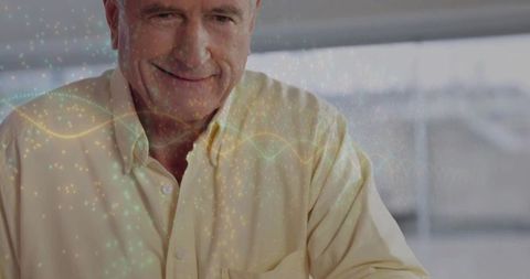 Senior Man Analyzing Digital Data with Innovative Interface