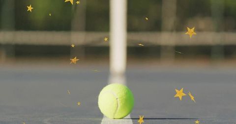Tennis Ball on Court with Star Graphics Creating Dynamic Sports Scene