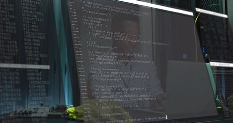 Developer coding javascript in modern server room