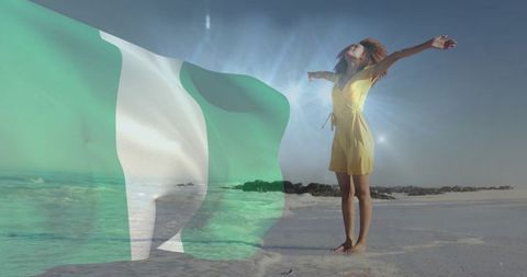 Woman standing on beach reaching sun with nigerian flag overlay