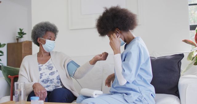 Healthcare Worker Checking Blood Pressure of Elderly Woman - Download Free Stock Images Pikwizard.com