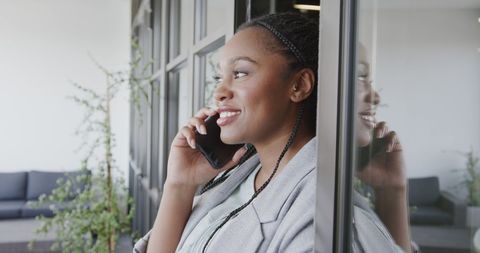 Professional Woman Smiling While Conversing on Smart Phone - Download Free Stock Images Pikwizard.com