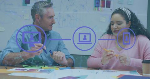 Colleagues Brainstorming with Digital Icons Overlay in Office Setting