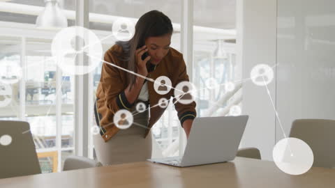 Businesswoman in Office Environment Connected Through Digital Network