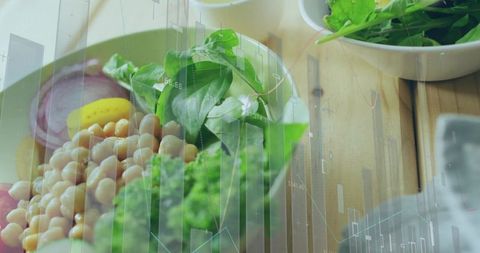 Merging healthy chickpea salad, greens and lemon with financial chart overlay
